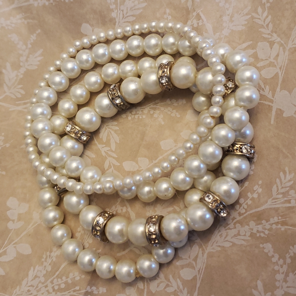Set of 4 Stretchy stacking faux pearl and crystal bracelets.